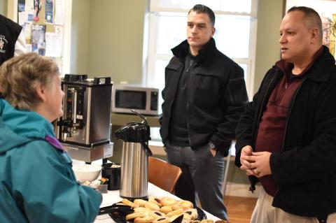 people having coffee and pastries with Tufts University Police Department members